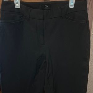 Black ankle length pants, slim fit.